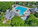 Aerial shot of a community swimming pool with winding slide and plenty of lounge chairs at 1027 Feather Oak Ln, Matthews, NC 28104