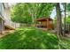 A view of the backyard including a custom built entertaining area at 11224 Amber Glen Dr, Charlotte, NC 28269
