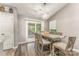 Elegant dining area with a stylish table set and access to a back deck at 11224 Amber Glen Dr, Charlotte, NC 28269