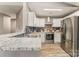 Modern kitchen featuring stainless steel appliances, granite countertops, and stylish backsplash at 11224 Amber Glen Dr, Charlotte, NC 28269
