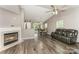 Inviting living room with a fireplace, open to the dining and kitchen areas at 11224 Amber Glen Dr, Charlotte, NC 28269