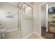 Bathroom with a glass-enclosed shower and convenient shelving at 11249 Island View Ln, Lancaster, SC 29720