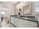 Bathroom featuring granite countertops, white cabinets, and decorative mirrors at 11249 Island View Ln, Lancaster, SC 29720