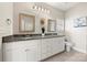 Bathroom with granite countertops, white cabinets, and decorative mirrors at 11249 Island View Ln, Lancaster, SC 29720