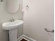 Powder room featuring a pedestal sink and modern fixtures at 11249 Island View Ln, Lancaster, SC 29720