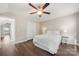 Inviting bedroom with wood floors, a ceiling fan, ensuite bathroom, and a closet for optimal storage at 11249 Island View Ln, Lancaster, SC 29720