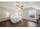 Spacious bedroom boasts hardwood floors, ceiling fan, and natural light from windows overlooking the backyard at 11249 Island View Ln, Lancaster, SC 29720