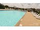 Inviting community pool with lounge chairs and umbrellas for a relaxing poolside experience at 11249 Island View Ln, Lancaster, SC 29720