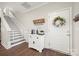 Inviting entryway features decorative coffee bar, staircase, and lovely accents, creating a welcoming ambiance at 11249 Island View Ln, Lancaster, SC 29720