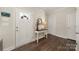 Inviting entryway with wood floors, table and decorative mirror at 11249 Island View Ln, Lancaster, SC 29720