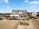 Charming single-story home featuring a welcoming front porch and well-manicured lawn, perfect for Gathering living at 11249 Island View Ln, Lancaster, SC 29720