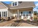Inviting front porch with stylish seating and meticulous landscaping, adding to the home's curb appeal at 11249 Island View Ln, Lancaster, SC 29720
