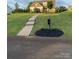 Beautifully landscaped front yard featuring a walkway and a charming home on a green lawn at 11249 Island View Ln, Lancaster, SC 29720