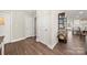 Bright hallway featuring wood floors, white trim, and a stylish built-in shelving unit at 11249 Island View Ln, Lancaster, SC 29720