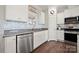 Well-appointed kitchen featuring stainless steel appliances, granite countertops, and stylish backsplash at 11249 Island View Ln, Lancaster, SC 29720
