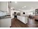Open-concept kitchen with a center island, stainless steel appliances, and seamless flow to the living area at 11249 Island View Ln, Lancaster, SC 29720