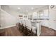 Bright kitchen features granite counters, a breakfast bar with seating, white cabinetry, and modern appliances at 11249 Island View Ln, Lancaster, SC 29720