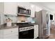 Modern kitchen featuring stainless steel appliances, granite countertops, and ample storage space at 11249 Island View Ln, Lancaster, SC 29720