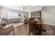 Spacious living area with lots of natural light, modern decor, and luxury vinyl flooring throughout at 11249 Island View Ln, Lancaster, SC 29720