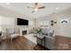 Bright living room with a fireplace, neutral decor, and lots of natural light at 11249 Island View Ln, Lancaster, SC 29720