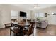 Open-concept living and dining area featuring a large window and comfortable seating, perfect for entertaining at 11249 Island View Ln, Lancaster, SC 29720