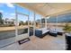 Comfortable screened porch with outdoor furniture and views of the surrounding community at 11249 Island View Ln, Lancaster, SC 29720