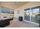 Relaxing screened-in porch with plush seating, mini fridge and views of a fenced backyard and neighborhood at 11249 Island View Ln, Lancaster, SC 29720