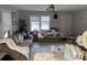 Cozy living room with large windows, neutral tones, and comfortable seating at 1203 Pamela Dr, Shelby, NC 28150