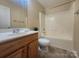 Cozy bathroom with wood vanity, framed mirror, and a combined shower-tub, perfect for everyday comfort at 121 Marcella Dr, Kings Mountain, NC 28086