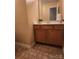 Vanity in bathroom with natural wood cabinets, sink, and large mirror at 121 Marcella Dr, Kings Mountain, NC 28086