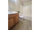 Cozy bathroom with wood vanity, framed mirror, and a combined shower-tub, perfect for everyday comfort at 121 Marcella Dr, Kings Mountain, NC 28086