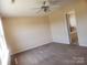 Spacious bedroom boasts a ceiling fan and an adjoining bathroom for added comfort and convenience at 121 Marcella Dr, Kings Mountain, NC 28086
