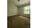Neutral bedroom features a bright window, light fixture, and ample space, offering a serene retreat at 121 Marcella Dr, Kings Mountain, NC 28086