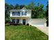 Charming two-story home with well-maintained front yard and attached garage at 121 Marcella Dr, Kings Mountain, NC 28086