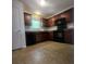 The kitchen features dark cabinets and black appliances at 121 Marcella Dr, Kings Mountain, NC 28086