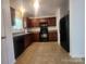 The kitchen has essential appliances, sleek countertops, and ample cabinetry at 121 Marcella Dr, Kings Mountain, NC 28086