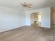 Spacious living room leading to the dining room with carpeted floors at 121 Marcella Dr, Kings Mountain, NC 28086