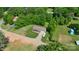 Aerial view of the home showcasing its well-manicured lawn and proximity to lush trees at 130 Helen Dr, Statesville, NC 28625