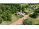 An aerial shot shows the landscaping, driveway and surrounding green trees near the residence at 130 Helen Dr, Statesville, NC 28625