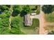 An overhead perspective of a home reveals a well maintained lawn and a long driveway at 130 Helen Dr, Statesville, NC 28625