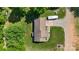 An overhead perspective of a home reveals a well maintained lawn and a long driveway at 130 Helen Dr, Statesville, NC 28625