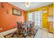 Warm dining room with colorful walls, tiled floors, and a table for four at 130 Helen Dr, Statesville, NC 28625