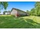 An exterior shot of a house with a green lawn and tan siding at 130 Helen Dr, Statesville, NC 28625
