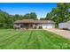 Charming single-story home with a covered porch, two-car garage, and a well-maintained lawn at 130 Helen Dr, Statesville, NC 28625