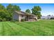 A lovely home with a verdant lawn, attractive landscaping, and a side-entry garage at 130 Helen Dr, Statesville, NC 28625