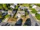 Aerial view of a home featuring well-manicured landscaping, a driveway, and a two-car garage at 13502 Brandon Trail Dr, Charlotte, NC 28213