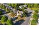 Overhead view of a well-kept home on a corner lot, showcasing its landscaped yard and surrounding neighborhood at 13502 Brandon Trail Dr, Charlotte, NC 28213