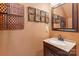 Stylish bathroom vanity with granite countertop, decorative mirror, and modern fixtures at 13502 Brandon Trail Dr, Charlotte, NC 28213