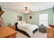 Cozy bedroom featuring soft walls, white bedding, and neutral carpet at 13502 Brandon Trail Dr, Charlotte, NC 28213