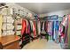 Large walk-in closet filled with a variety of clothing and storage options at 13502 Brandon Trail Dr, Charlotte, NC 28213